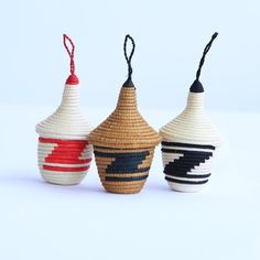 three small baskets with different designs on them