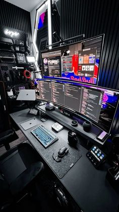 a computer desk topped with two monitors and a keyboard next to a mouse on top of a black table