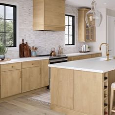 a large kitchen with wooden cabinets and white counter tops, along with an island in the middle