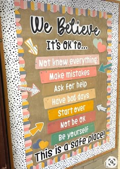 a bulletin board with words written on it in front of a door that says, we believe it's ok to not know everything