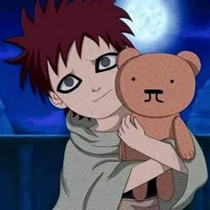 a boy holding a teddy bear in his arms