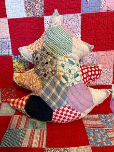 a patchwork quilt with many different colors on it