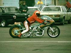 a man riding on the back of a motorcycle