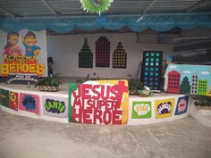 an outdoor stage set up for a children's play area with signs and decorations