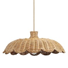 a wicker light hanging from a ceiling fixture