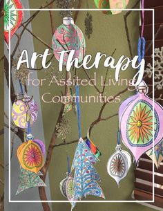 an art therapy for assisted living communities with ornaments hanging from the tree and snowflakes on the branches