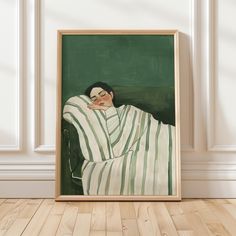 a painting of a woman wrapped in a blanket on a wooden floor next to a wall