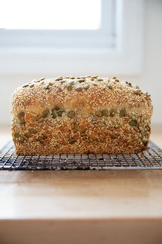 a loaf of bread sitting on top of a cooling rack