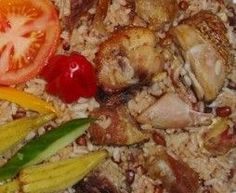 a close up of food on a plate with tomatoes and peppers next to meats