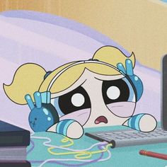 a cartoon character with headphones on sitting in front of a computer