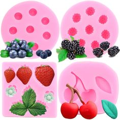 four different shapes of fruit molds on a pink background with berries, cherries and raspberries