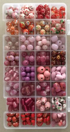 a plastic container filled with lots of different colored beads