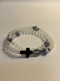 Clear two wrap rosary bracelet with white and black beads and sliver spacers beaded with glass beads Rosary Bracelet, Spring Hill, Black Beads, Spacer Beads, Rosary, Glass Beads, Jewelry Bracelets, White And Black, Beaded Bracelets