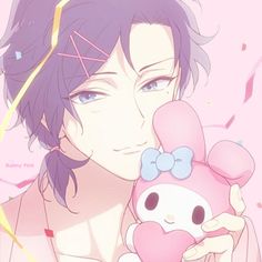 an anime character holding a hello kitty doll