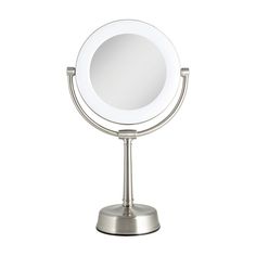 a round mirror sitting on top of a metal stand