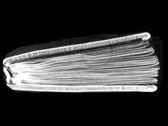 a black and white photo of a stack of papers