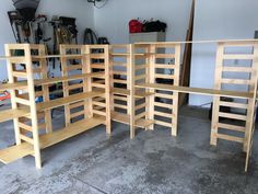 the shelves are made out of wood and have ladders attached to them for storage