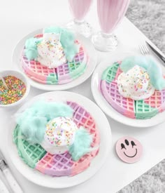 three waffles decorated with sprinkles on plates