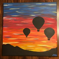 an acrylic painting of three hot air balloons in the sky at sunset or dawn