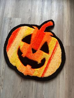 a door mat with a pumpkin on it