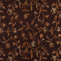 a brown and orange floral pattern on fabric