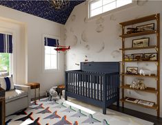 a baby's room with a crib, chair and bookshelf in it