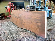 a large piece of wood sitting next to a truck