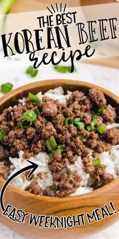 the best korean beef recipe in a wooden bowl with rice and green onions on top