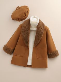 Wrap Your Toddler Baby Girl in Warmth and Style with our Brown Rust Shearling Lapel Collar Coat - Complete with Beret for a Cozy Fall and Winter Look and Perfect Gift! 🍂👧❄️ Elevate your little one's fashion game with our charming brown rust shearling lapel collar coat. Crafted with attention to detail, this coat features a unique raw finish and pockets for added functionality. The included beret completes the ensemble, making it a perfect gift for the fall and winter seasons. Whether it's for Brown Overcoat, Lapel Collar Coat, Baby Coat, Baby Outerwear, Girls Outerwear, Collar Coat, Collared Coat, Girl Coat