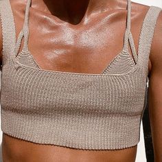 a close up of a person wearing a sports bra