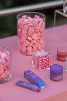 a pink table with Laneige products and a jar of starbursts Sleeping Mask, Pop Up, Mask, New York, Water