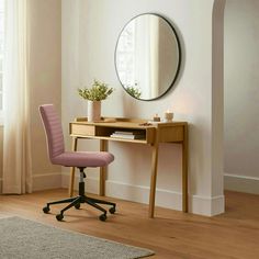 a desk with a mirror, chair and potted plant