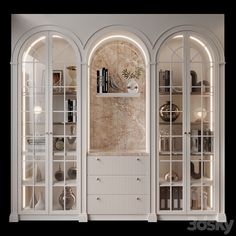 a room with arched glass doors and shelves filled with books, vases and other items