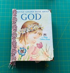 a little golden book about god on a cutting board