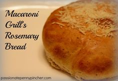 a close up of a bread on a plate with grated cheese in the middle