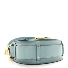 This is an authentic CHLOE Calfskin Small Tess Bag in Faded Blue. This chic crossbody shoulder bag is crafted of calfskin leather in classic blue. The bag features an adjustable leather shoulder strap with stylized large handle anchors, a matching handle, and gold hardware. The bag unsnaps to a front pocket and beige fabric interior with a slip pocket. Beige Fabric, Classic Blue, Anchors, Crossbody Shoulder Bag, Gold Hardware, Front Pocket, Calf Skin, Chloe, Shoulder Strap