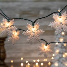 snowflake lights are hanging on a string