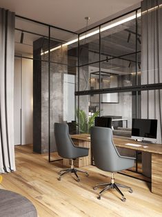 an office with glass walls and wooden floors