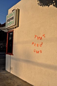 graffiti on the side of a building that reads, that feel good