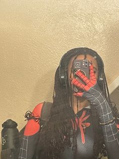 a woman with long hair wearing headphones taking a selfie