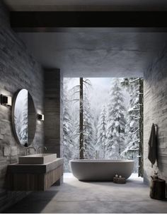 a large white bath tub sitting next to two sinks in a bathroom under a window