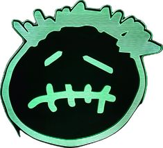 a black and green sticker with an image of a monster's head on it