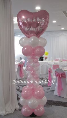 balloons are arranged in the shape of a heart for a wedding day decoration at a banquet hall