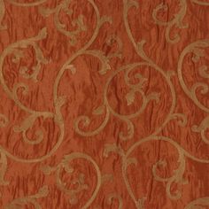 an orange and gold wallpaper with swirls on it's side, in the middle