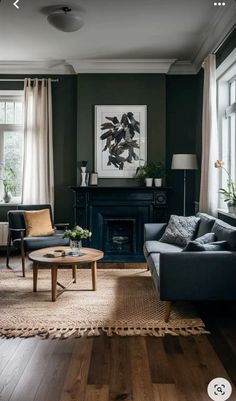 a living room with two couches and a coffee table in front of a fireplace