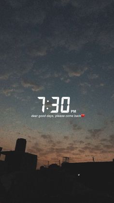 the sky is very dark and cloudy at night, with an alarm clock on it