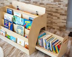 a child's wooden book stand with books in it