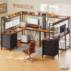 an office with two desks and a chair in the corner, along with a computer