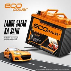 an orange car battery sitting on the side of a road next to a yellow car