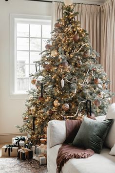 a decorated christmas tree in a living room